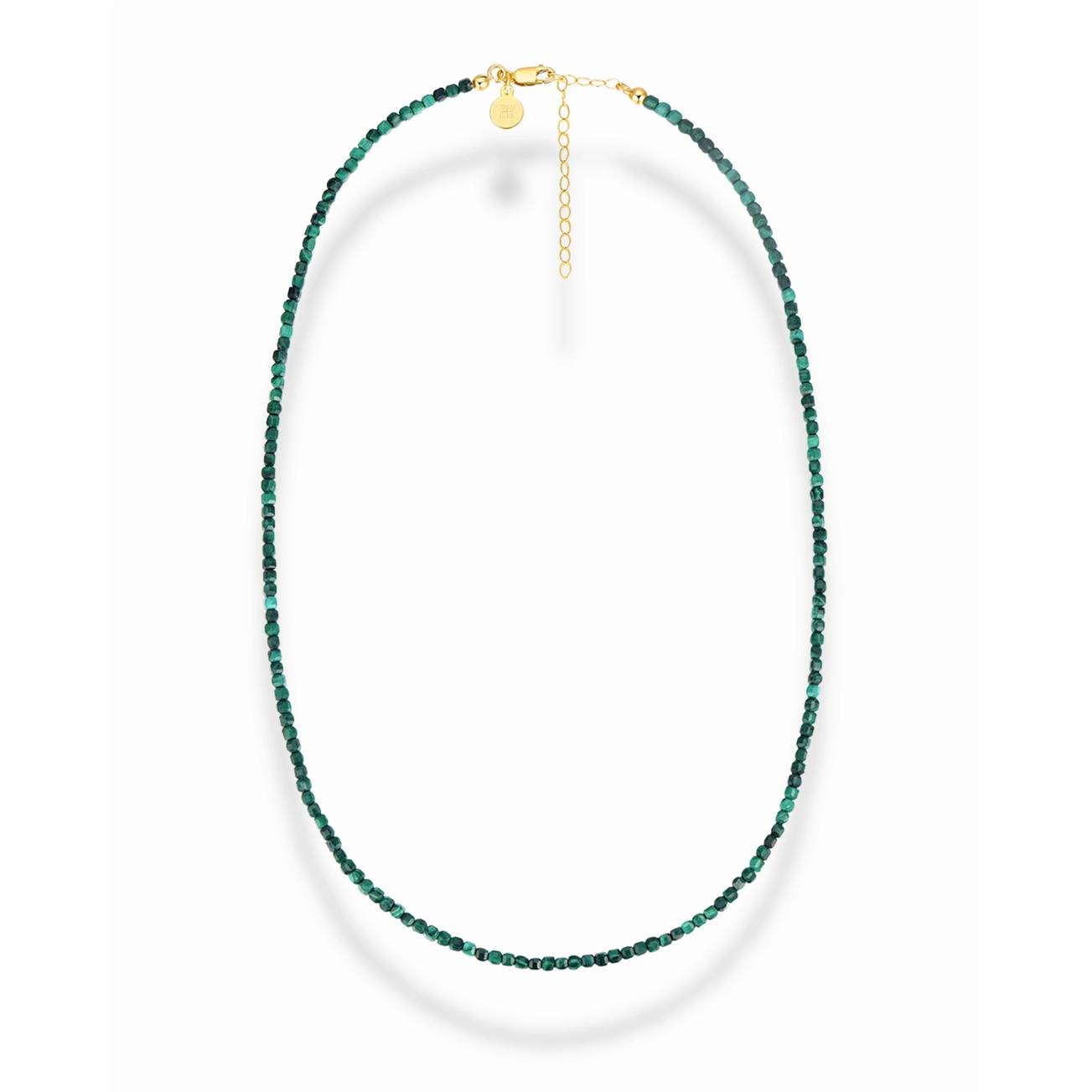 a malachite beaded necklace with a gold clasp on a white background