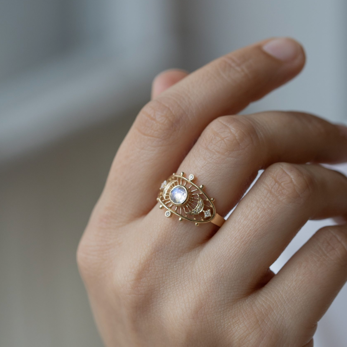 "14K solid yellow gold ring with 0.5 × 0.5 cm moonstone and 0.09 ct diamonds — moonstone enhances divine feminine energy, emotional balance, and inner growth; made-to-order sizes ship in 4–6 weeks, resizable up or down 2 sizes.