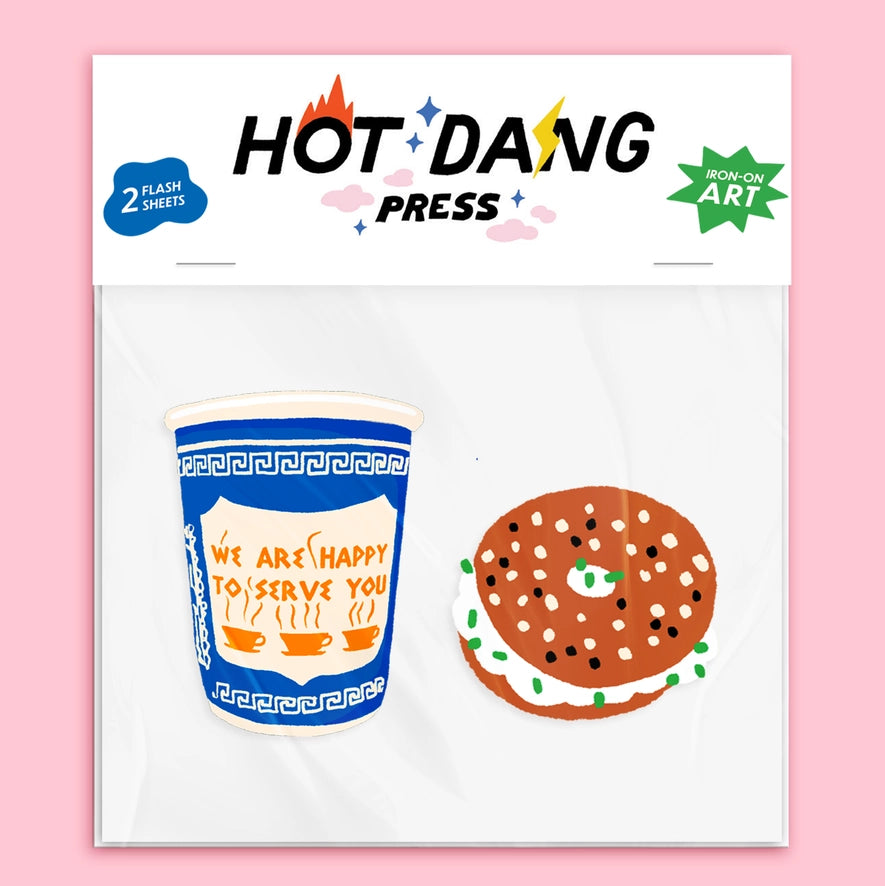 Hot Dang Press packaging with a coffee cup and bagel illustration on a pink background
