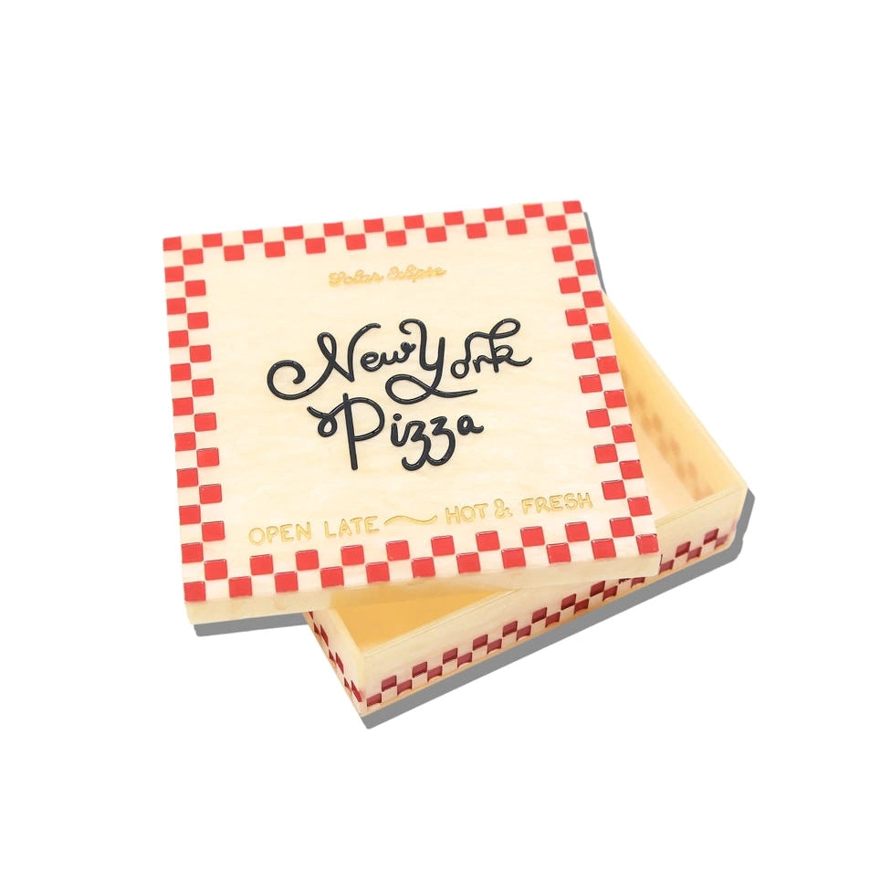 an ivory and red box in the style of a pizza box with black text reading new york pizza with a white background