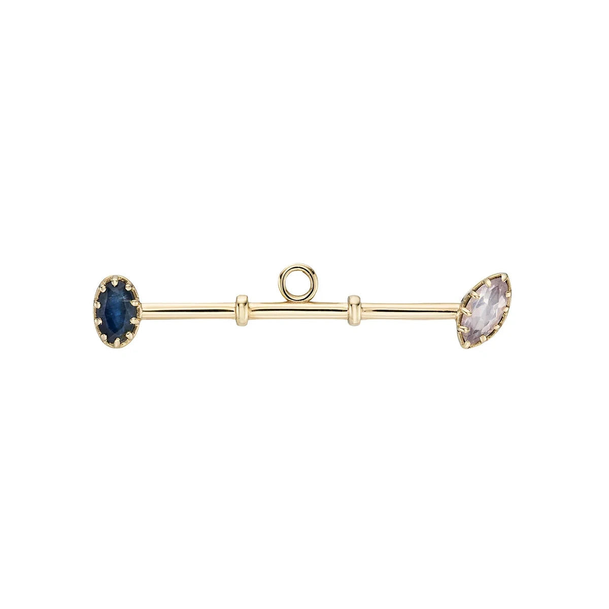 Gold bar bar charm with blue and clear gemstones on a white background