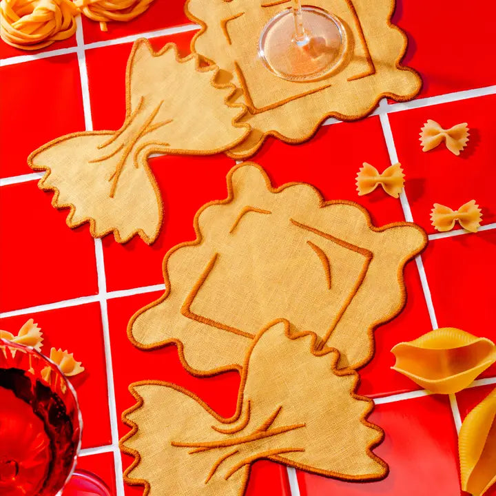 Linen pasta shaped napkins on a red checkered background