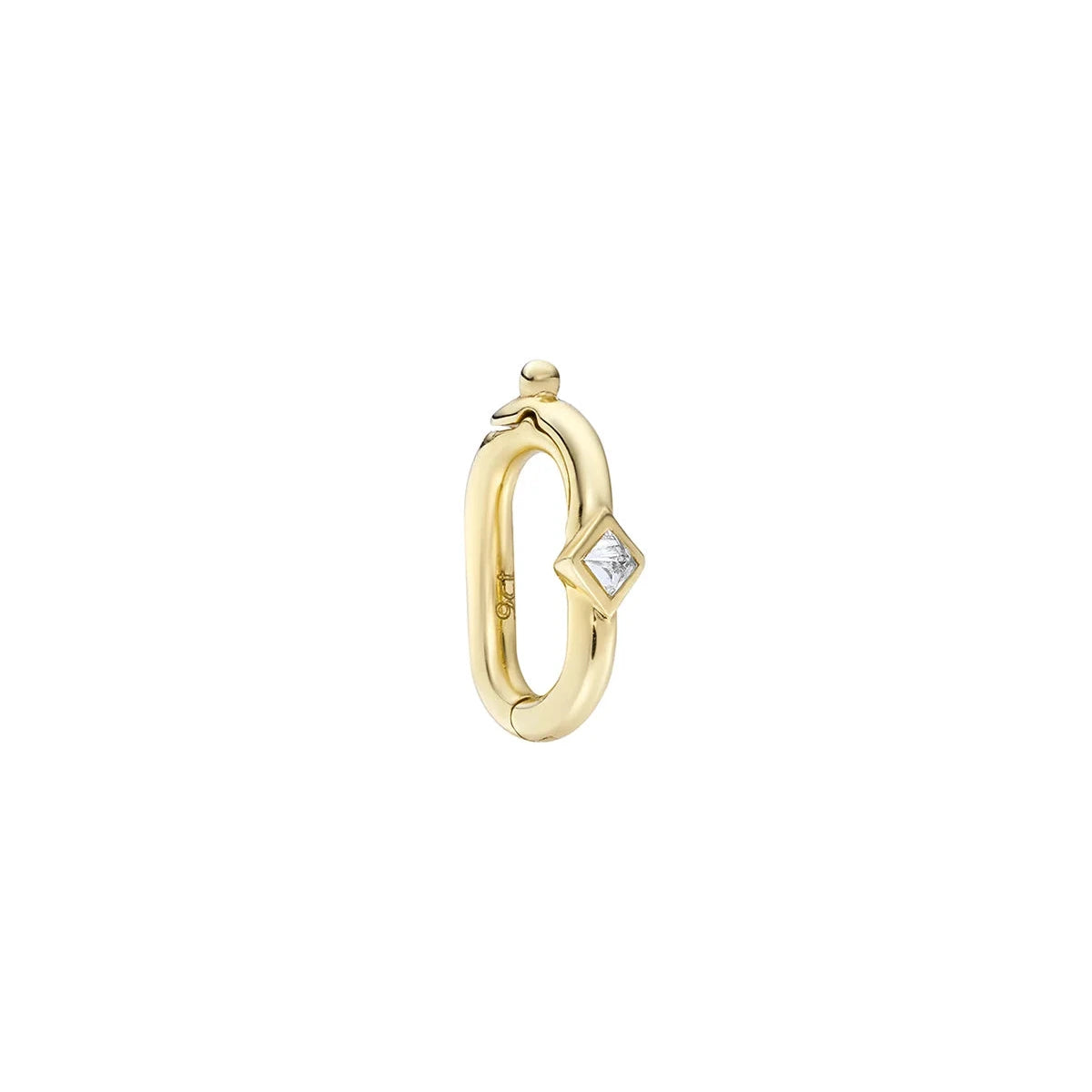 A gold charm connector featuring a small clear diamond-shaped gemstone on the front, set against a solid white background.