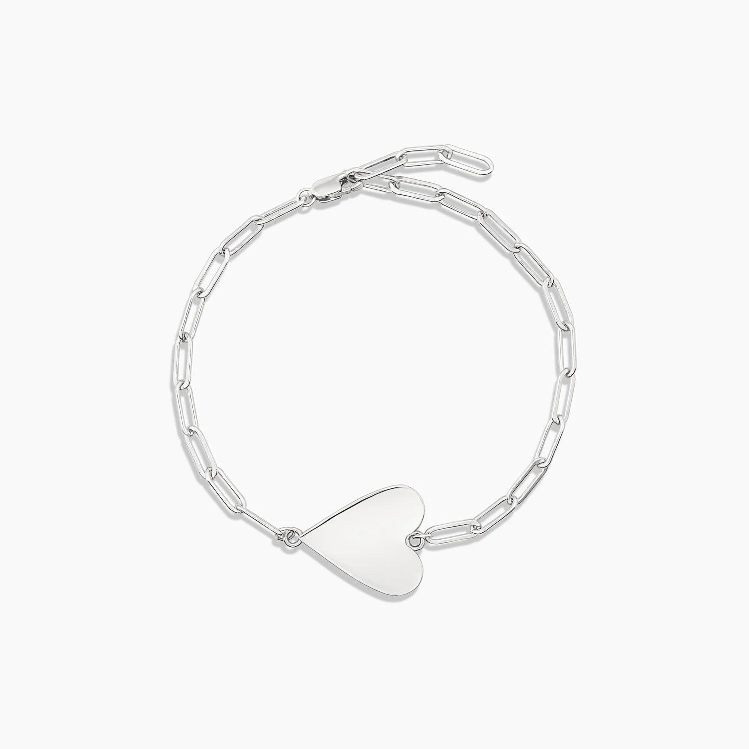 a silver chain bracelet with a heart charm on a white background