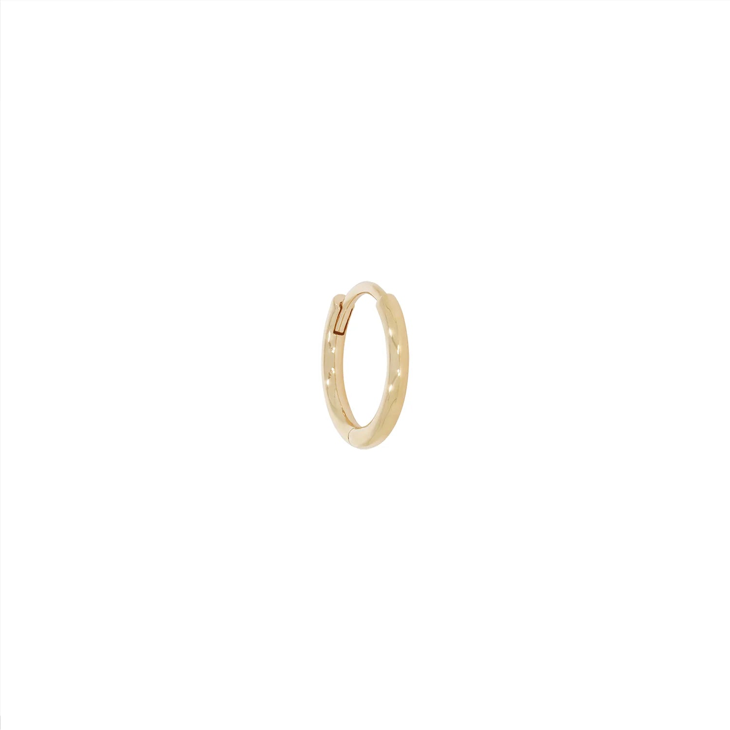 a round gold hoop earring with a hinge back over a white background