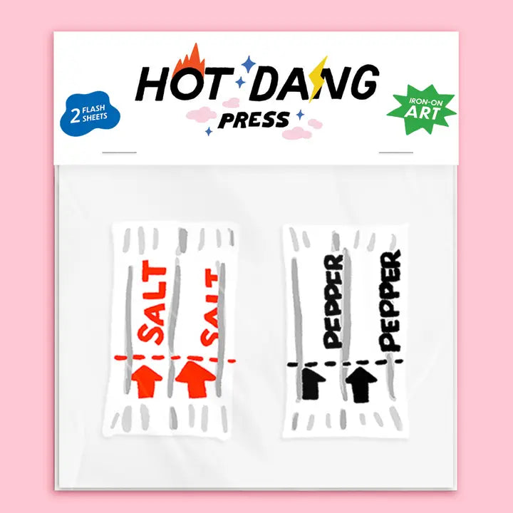 Hot Dang Press salt and pepper flash sheets in a clear plastic bag with a white header card. The header features the 'HOT DANG PRESS' brand logo, a blue '2 FLASH SHEETS' badge, and a green 'DESIGN ART' badge.