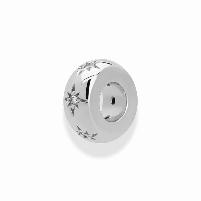 silver bead shaped charm with star accents and white stone inlays with a white background