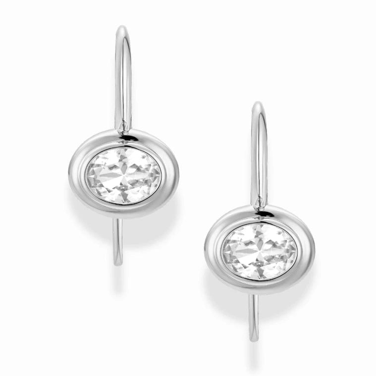 Silver earrings with clear gemstones on a white background