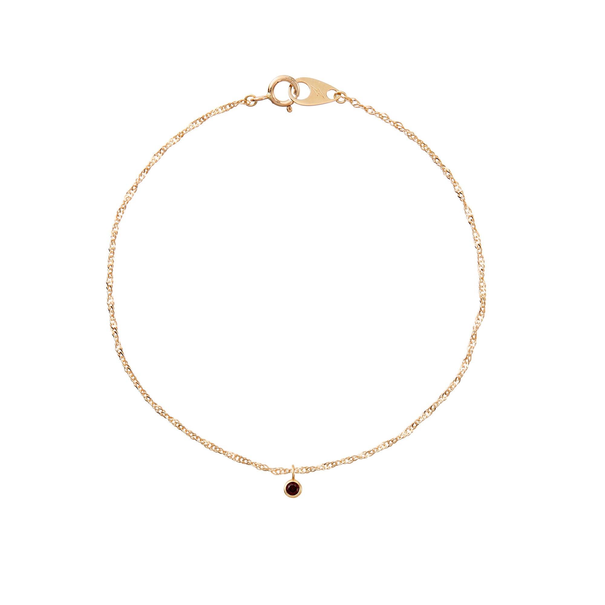 Gold bracelet with a small black gemstone on a white background