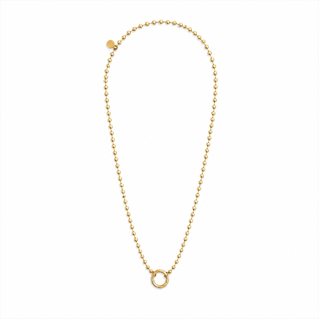 A delicate gold ball chain necklace with a small circular ring pendant, displayed on a clean white background.