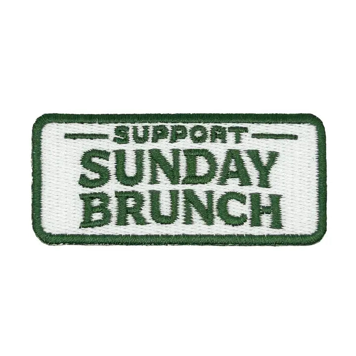 a green and white iron on patch with text reading support sunday brunch over a white background