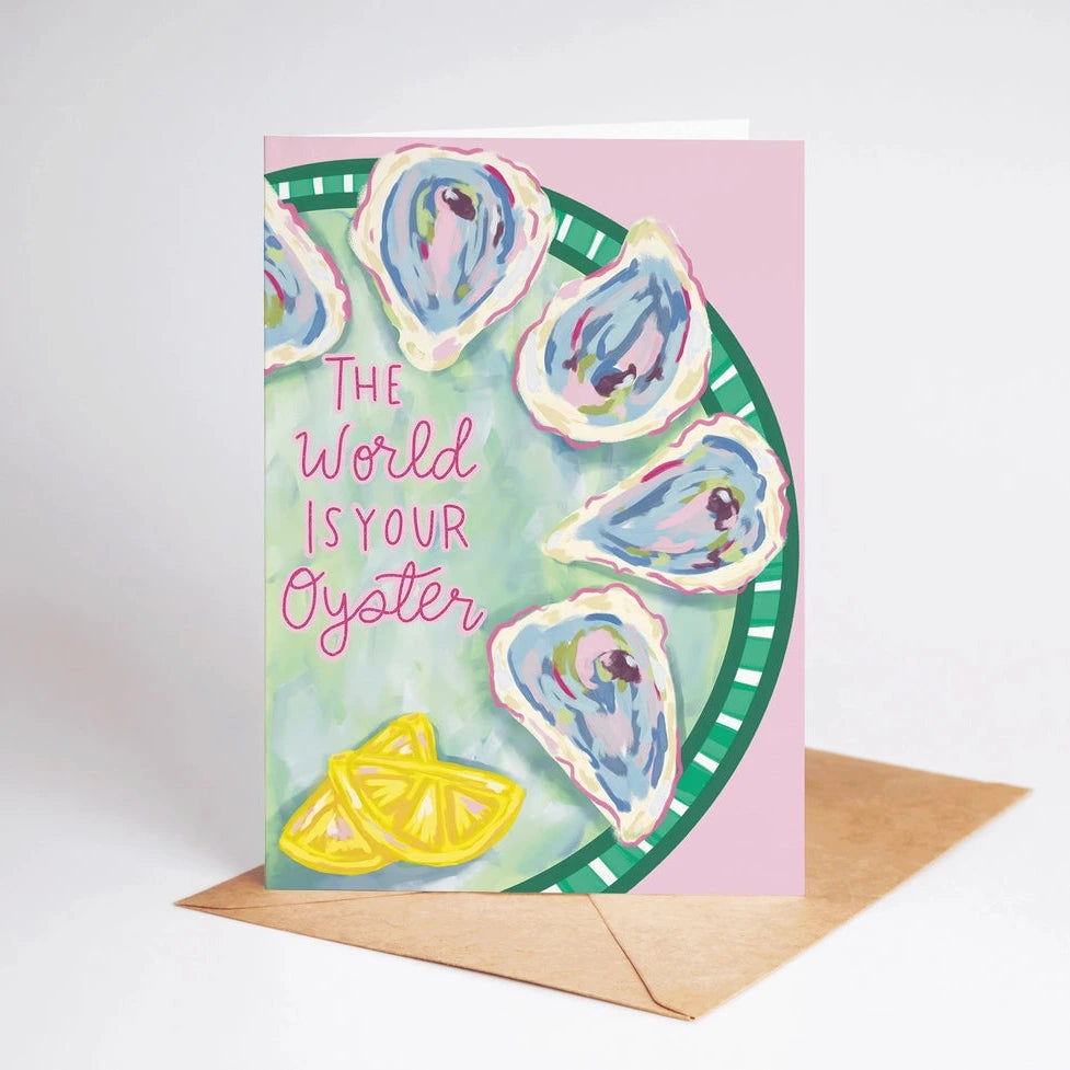Greeting card with oyster design and 'The World is Your Oyster' text on a pink background