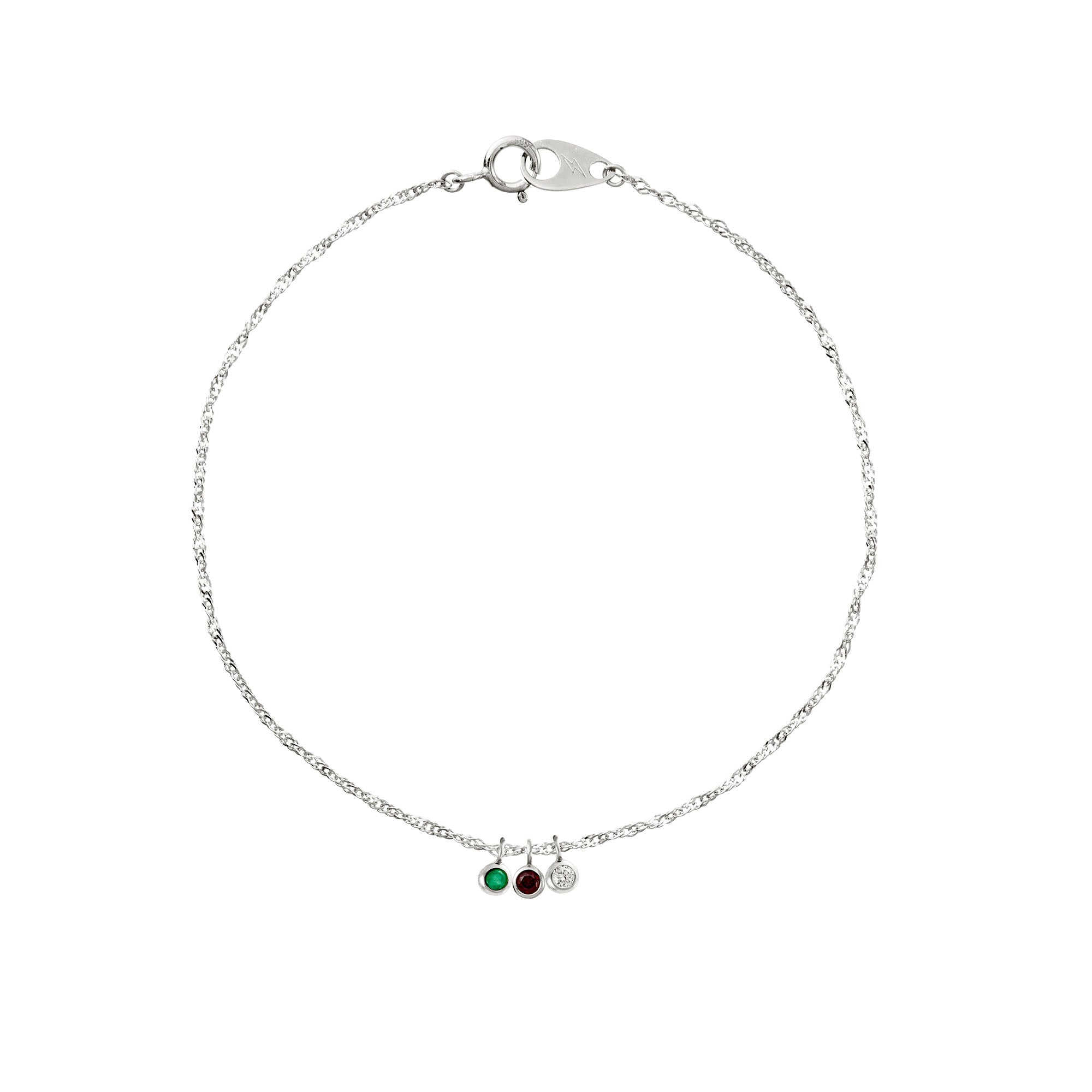 Whit gold bracelet with three charms on a white background