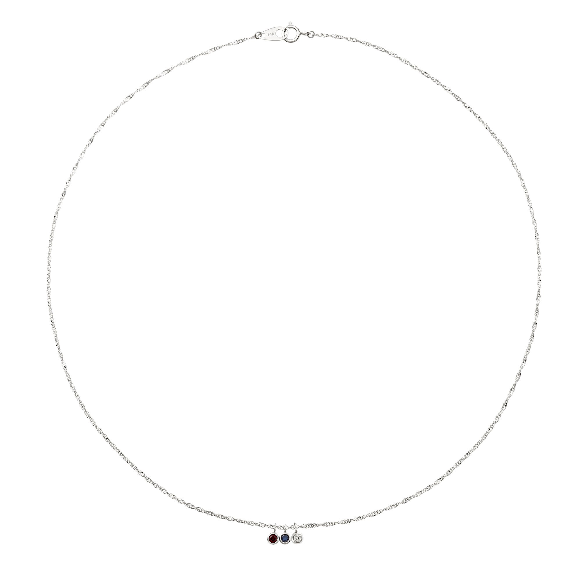 Silver necklace with small round pendants on a white background