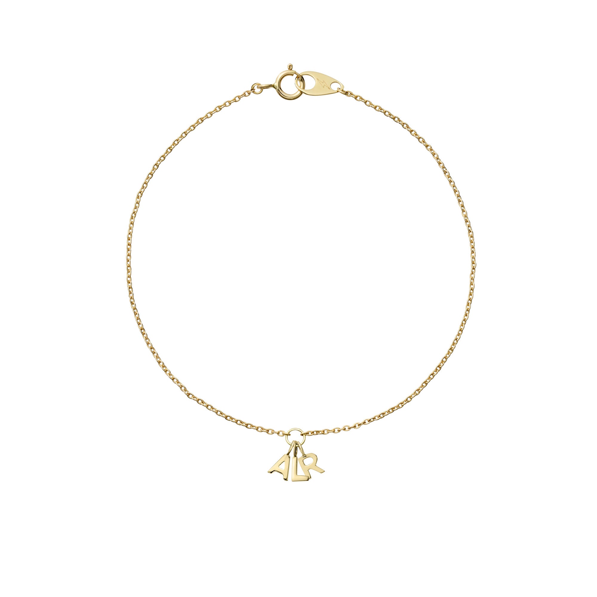 14k yellow gold mini cable bracelet with three initial charms on white background