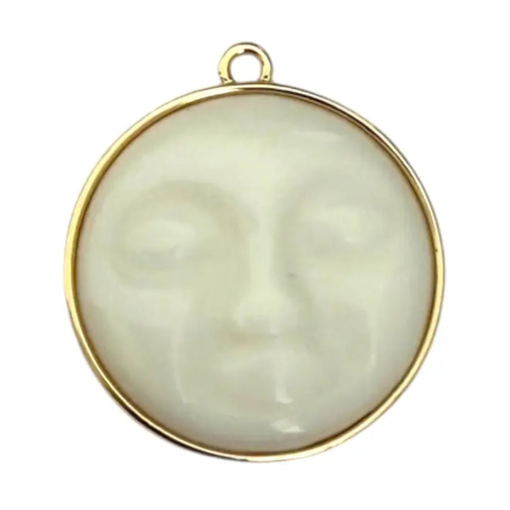 gold plated moon face charm on a white background