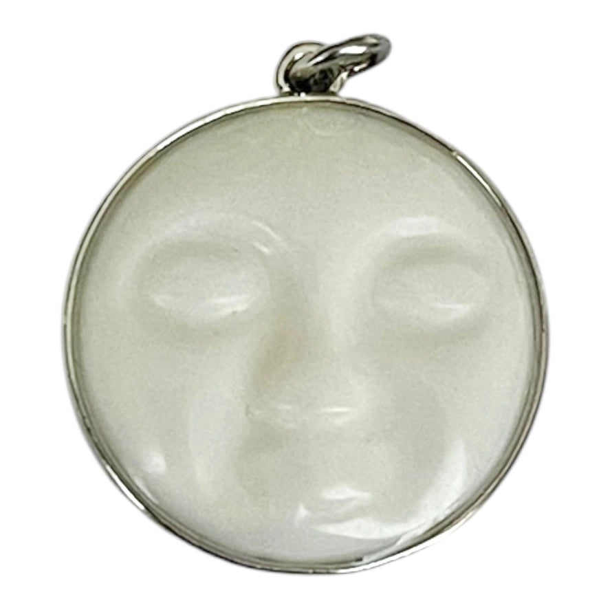 a silver moon face charm with a silver jumpring on a white background