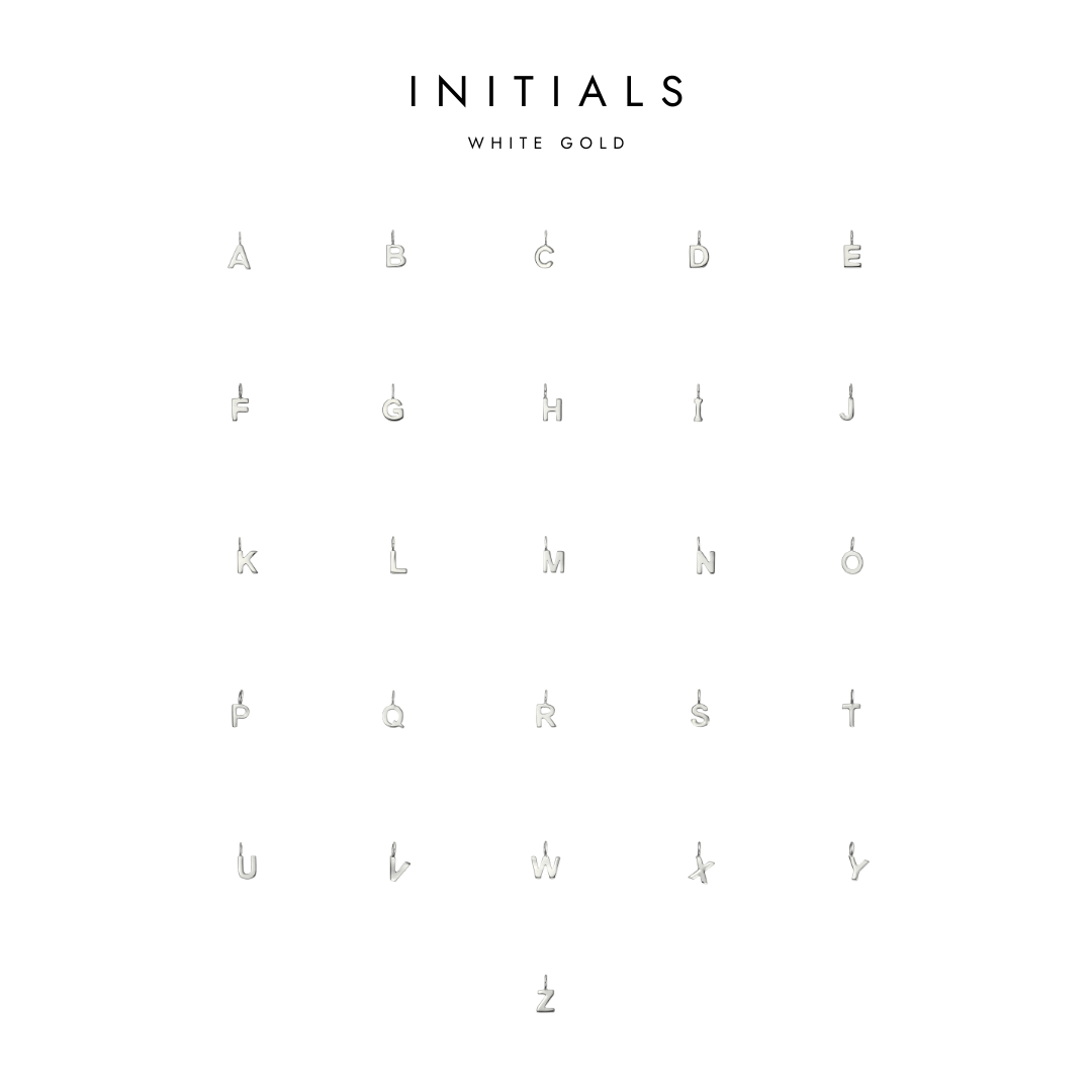 A collection of white gold initial charms, arranged in rows with 'INITIALS' text at the top.