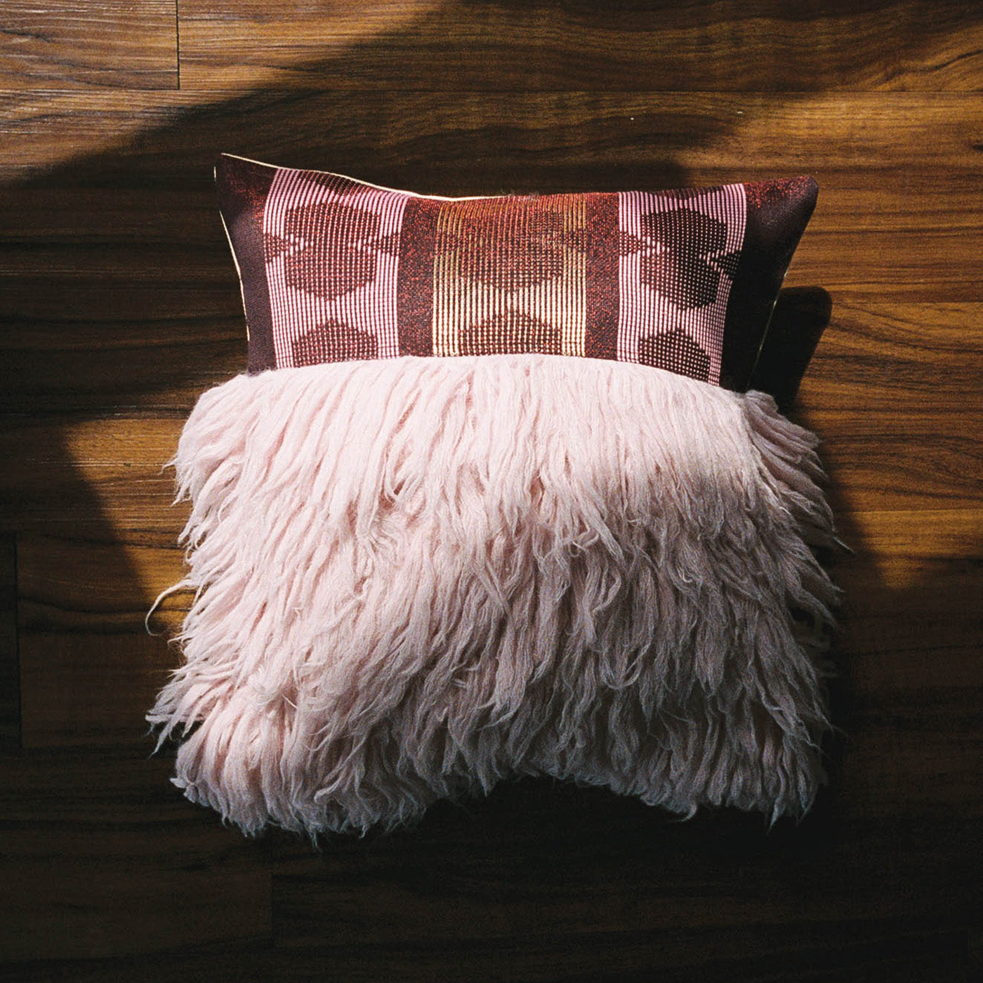 Geometric Pattern Textured Throw Pillow on Wood