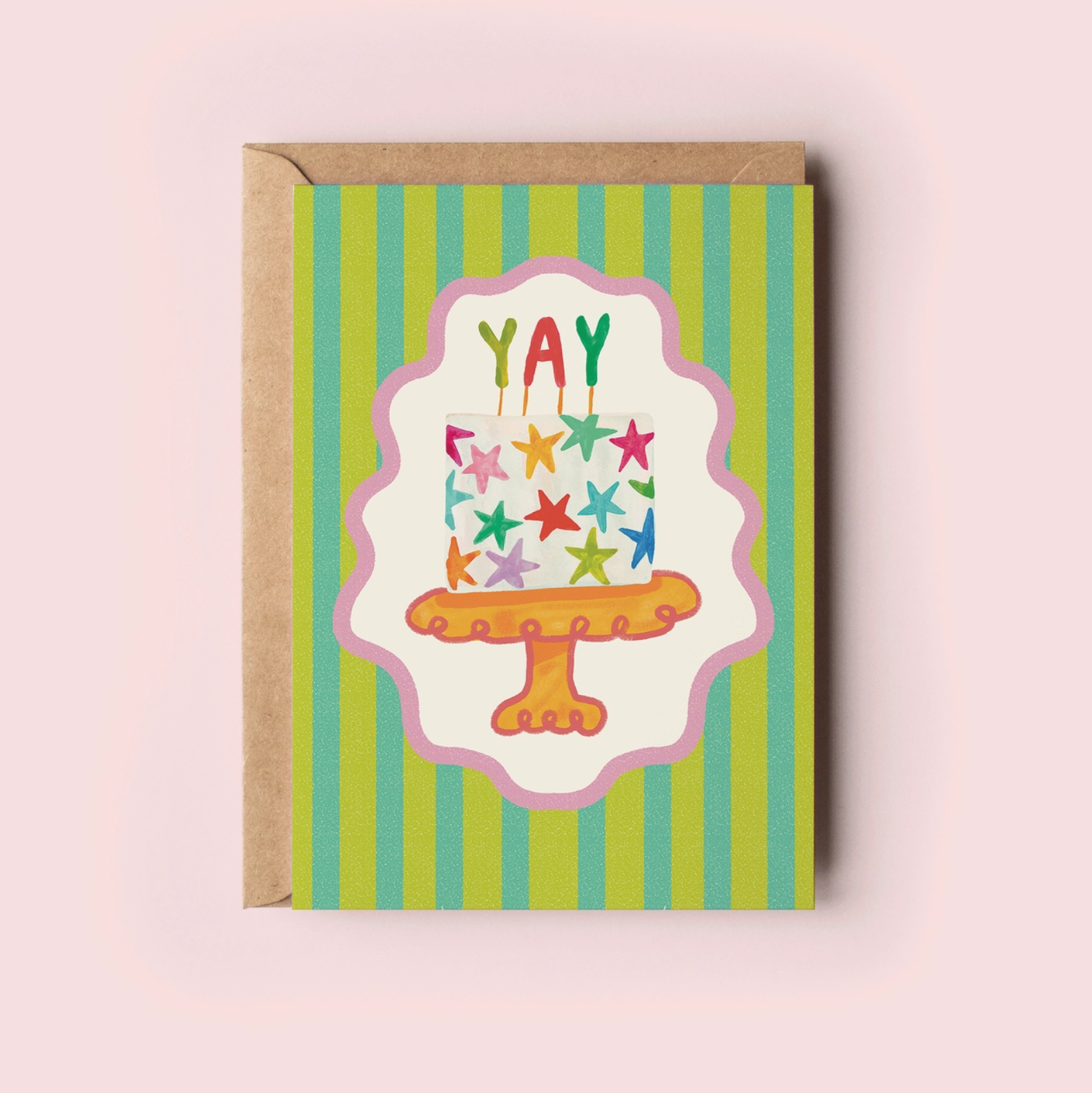 YAY cake topper greeting card on light pink background with kraft envelope