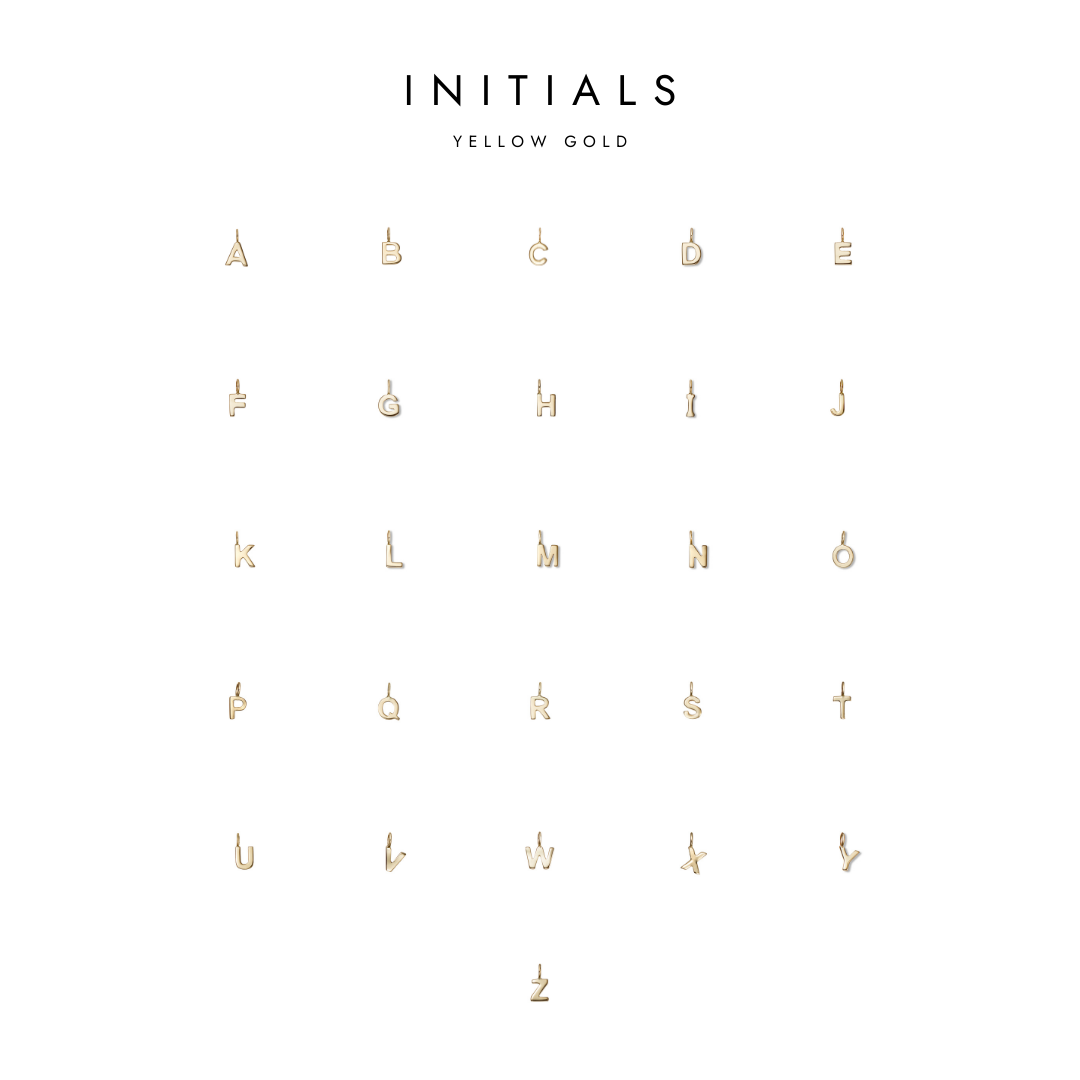 A collection of gold initial charms, arranged in rows with 'INITIALS' text at the top.