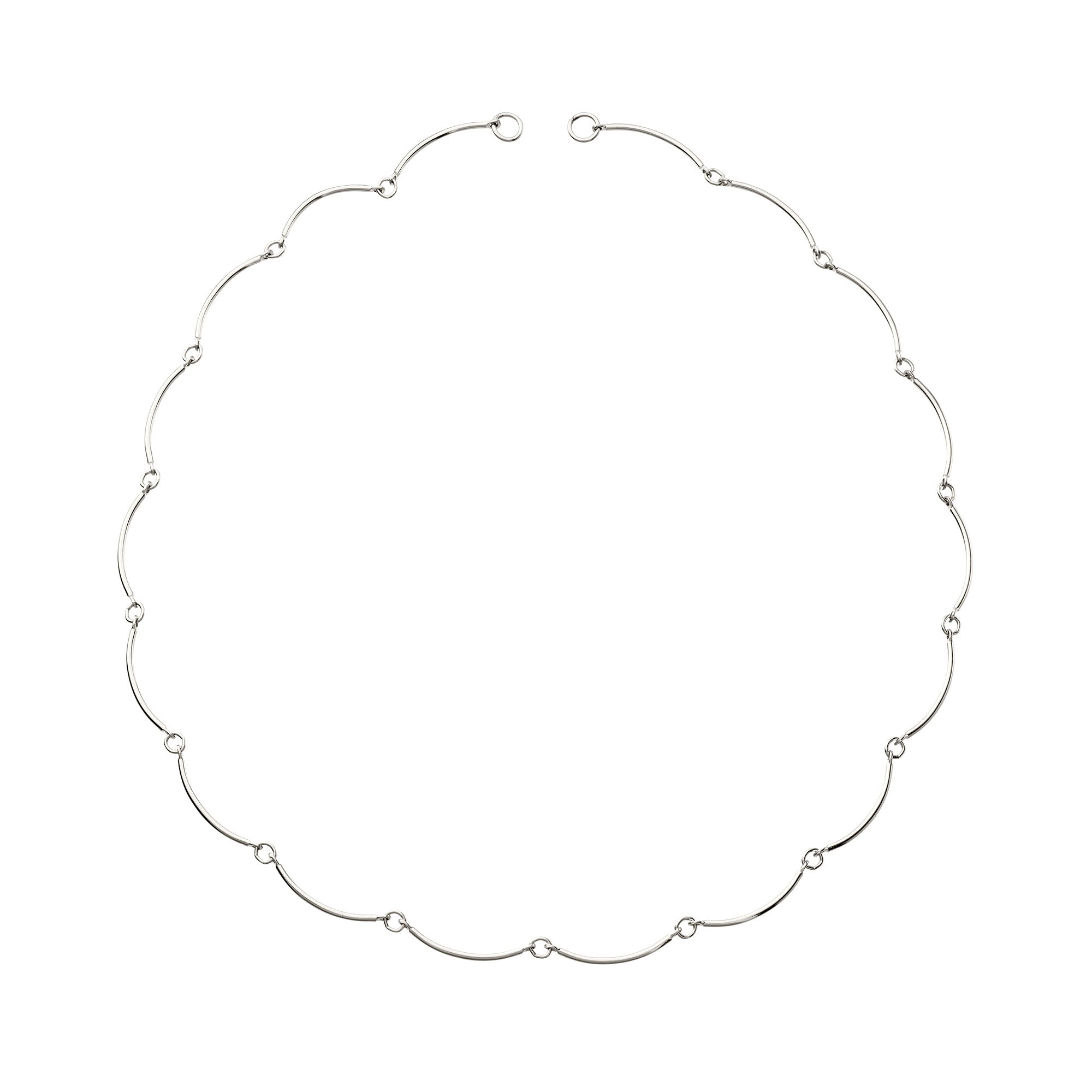 Silver wavy necklace on a white background