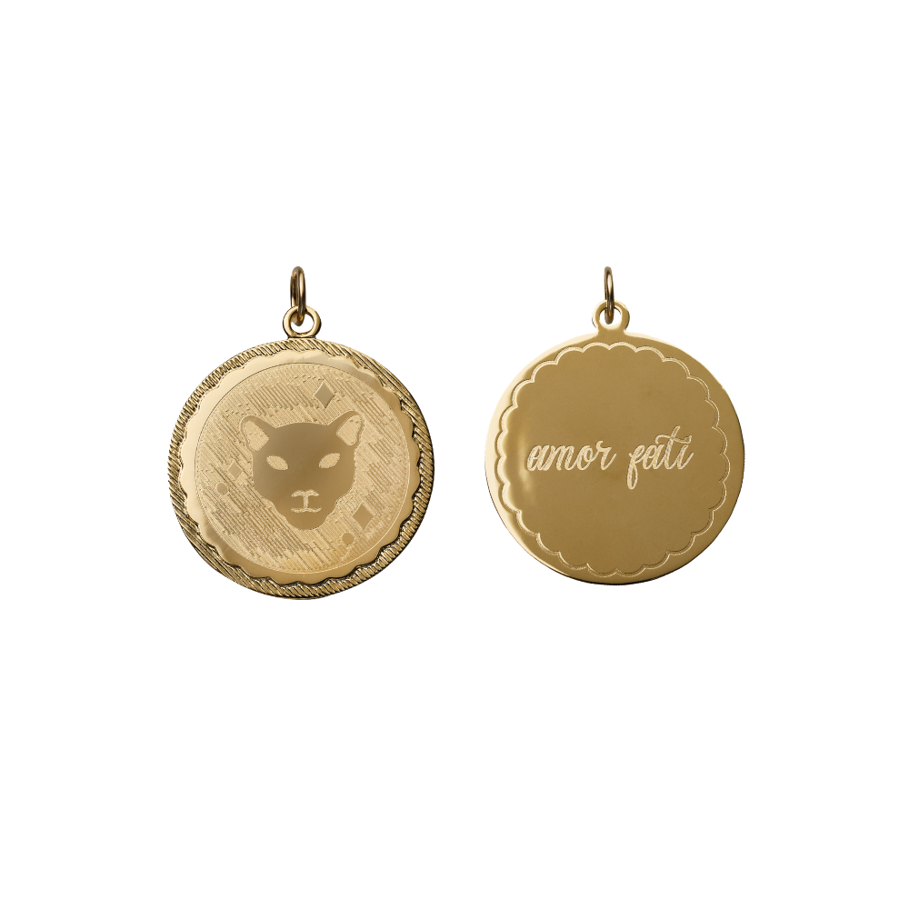 double sided engraved coin with a panther on one side and amor fati on the other side on white background