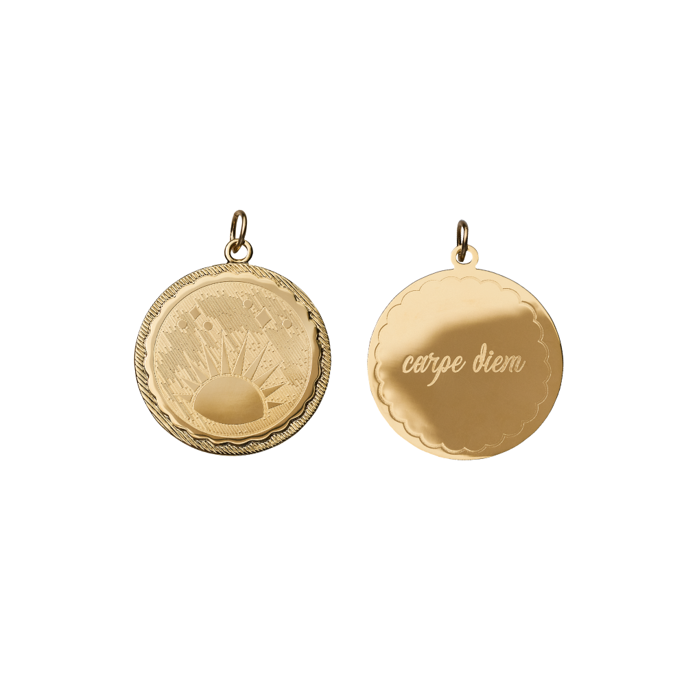 double sided engraved coin with a sun rise on one side and carpe diem on the other side on white background