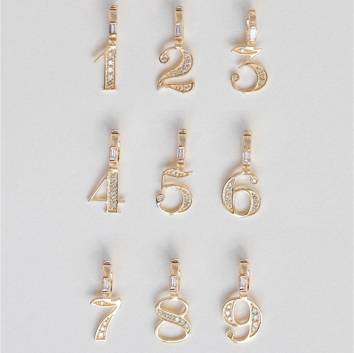 yellow gold diamond numbers 1-9 on a white background