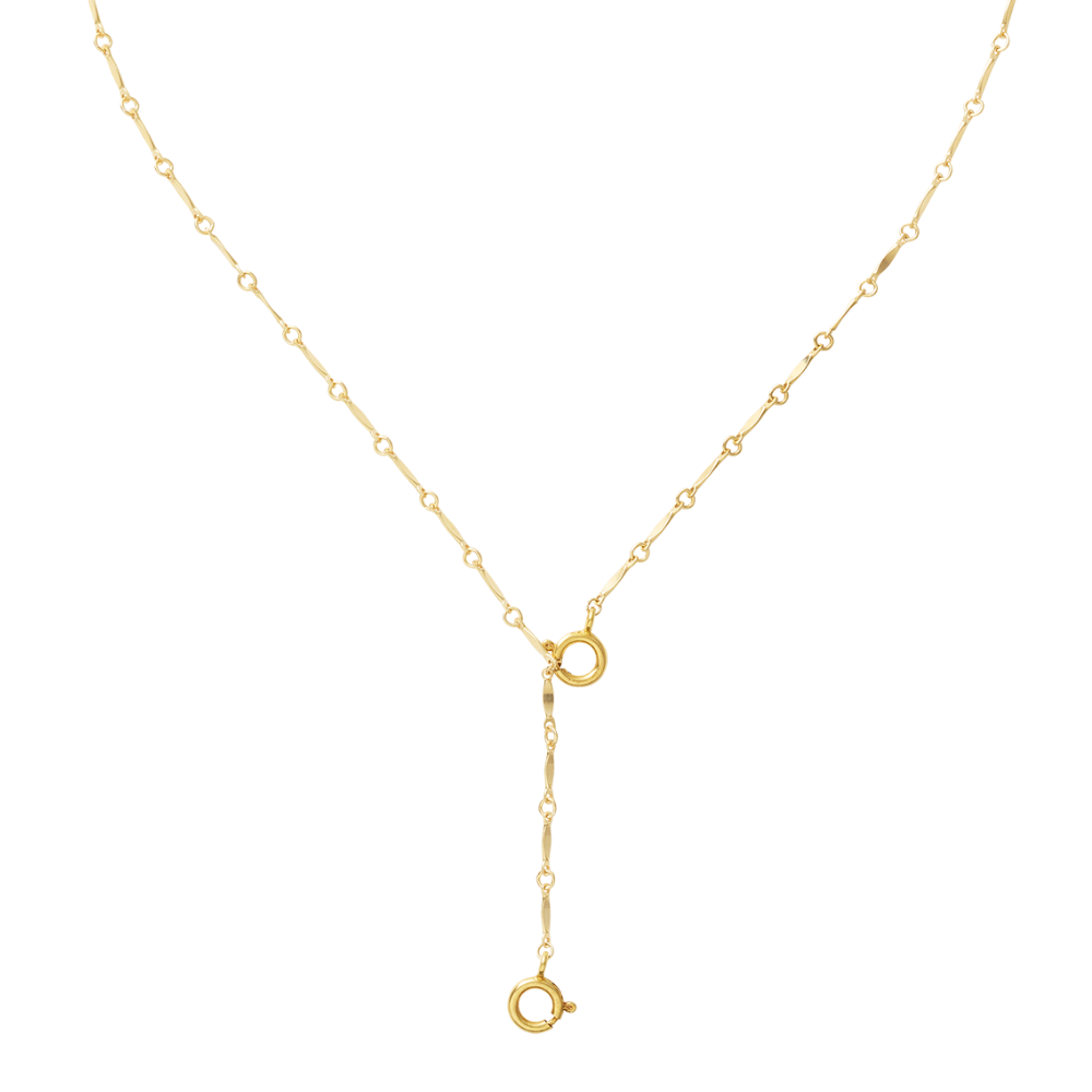 Gold lariat necklace on a white background