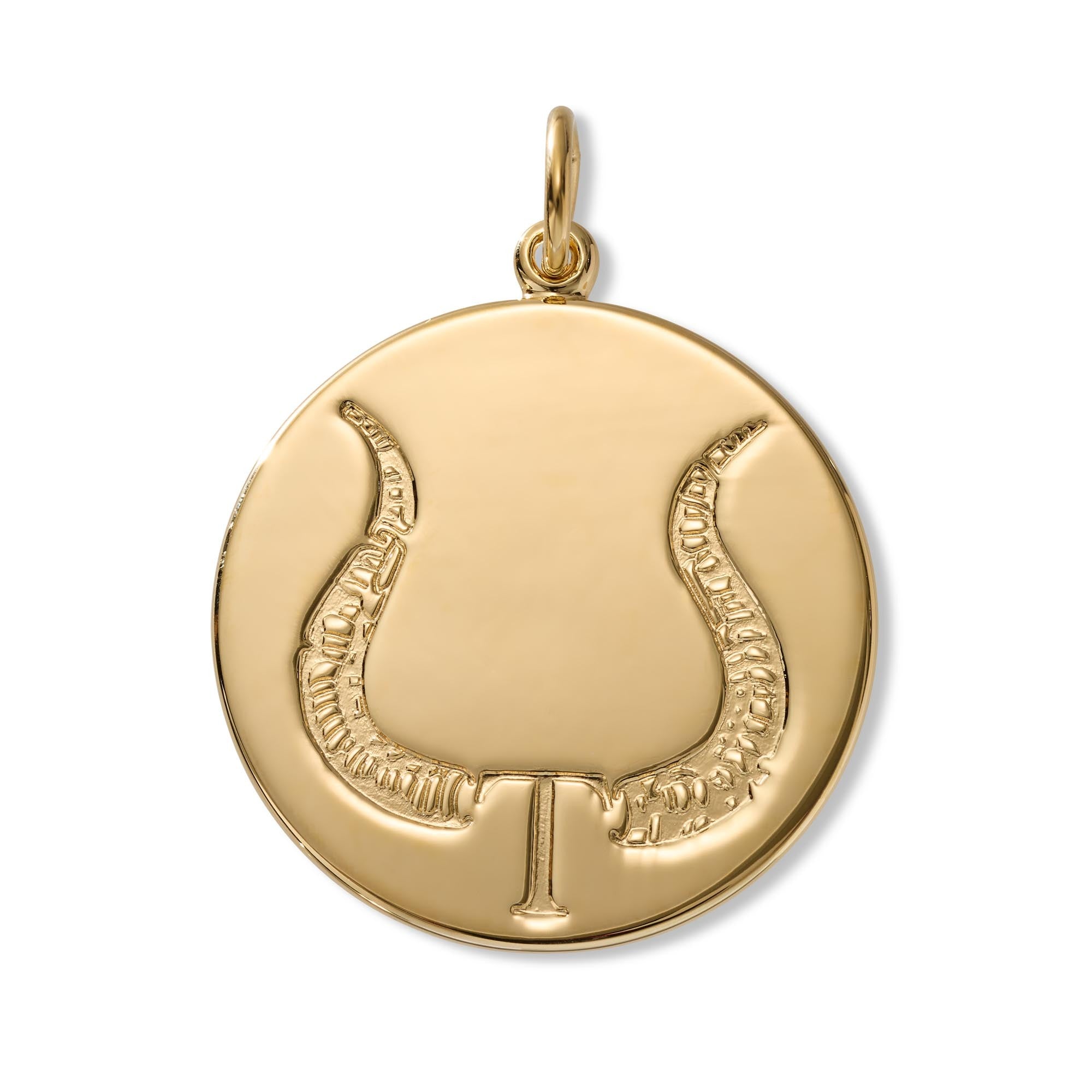 A round gold pendant featuring a stylized bull symbol with a hanging loop at the top, shown on a clean white background.