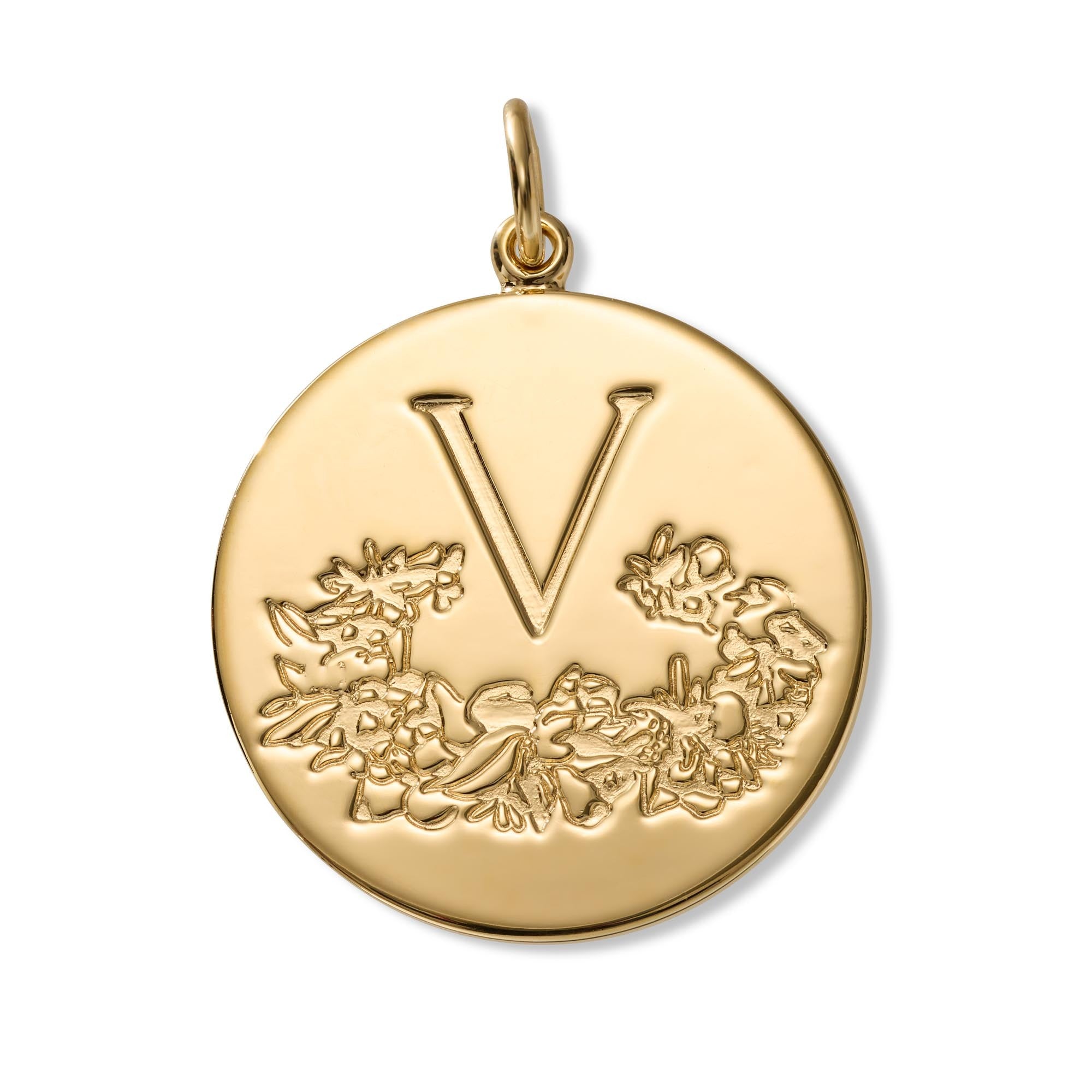 A round gold initial pendant featuring the letter 'V' above an embossed floral wreath, with a top bail, shown on a clean white background.