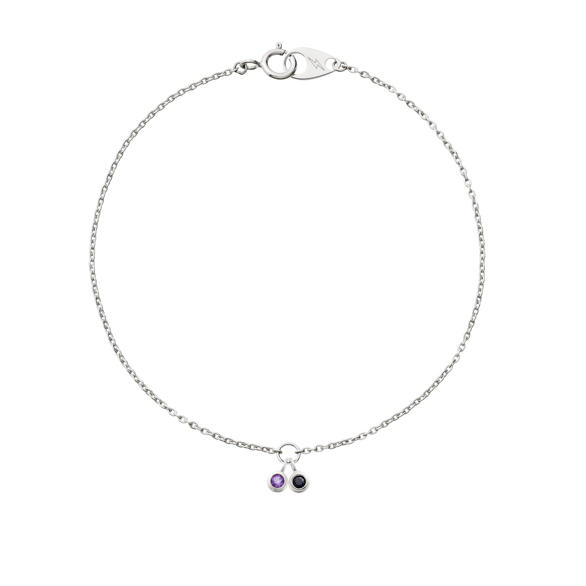 Two delicate hanging 14k white gold birthstones on a 14k white gold mini cable bracelet on white background