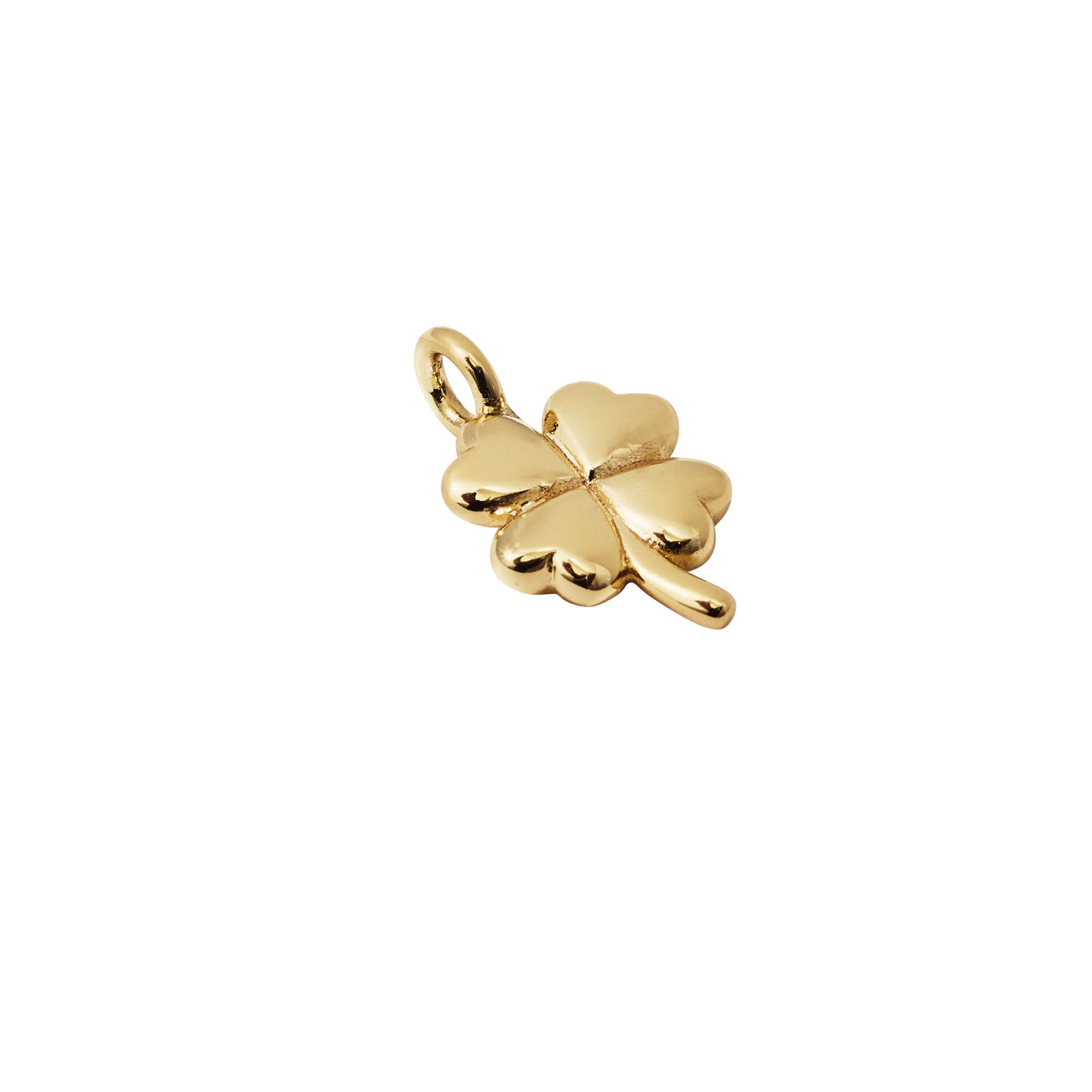 Gold four-leaf clover charm on a white background