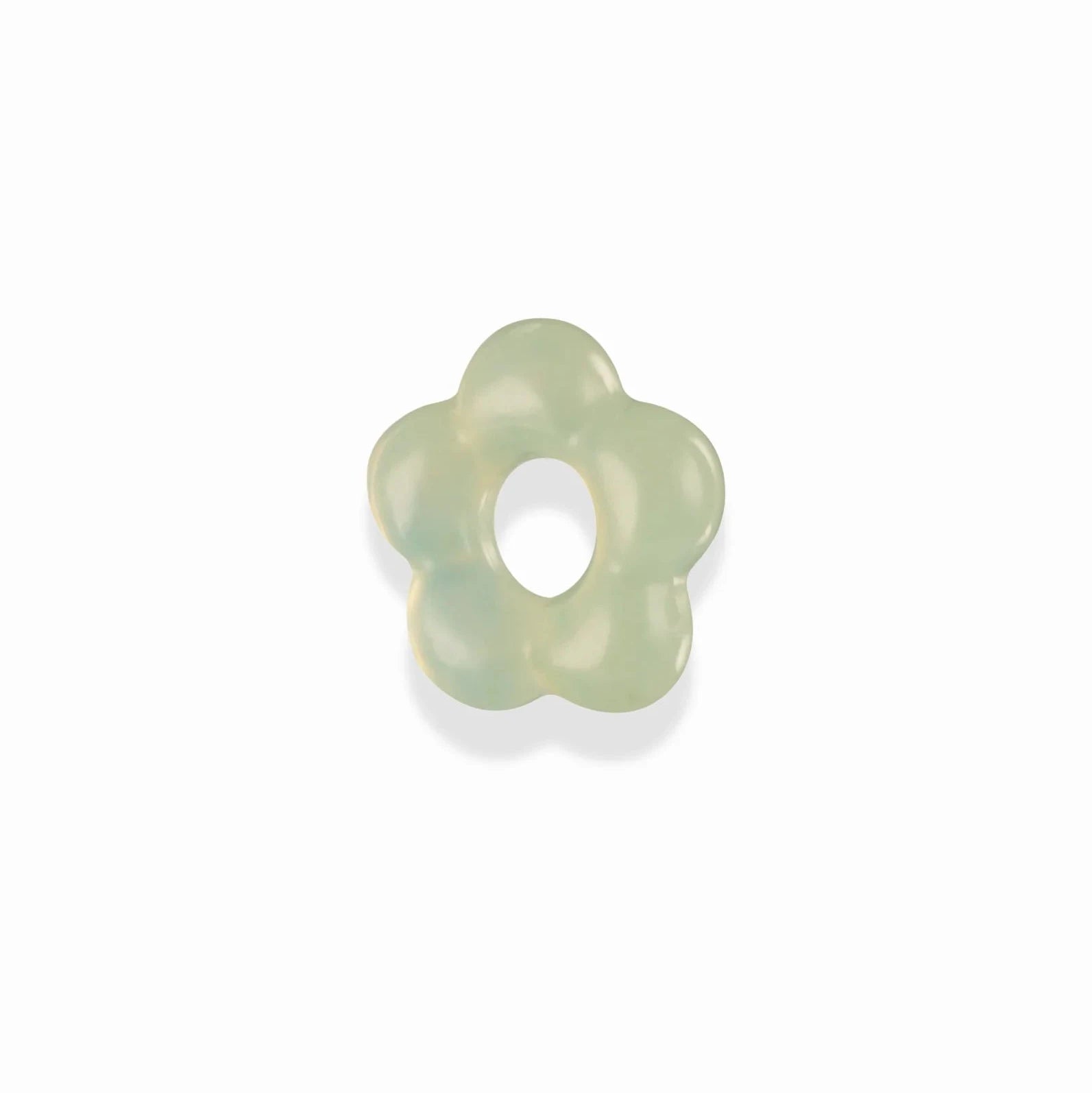 a pale green gemstone spacer bead in the shape of a flower over a white background
