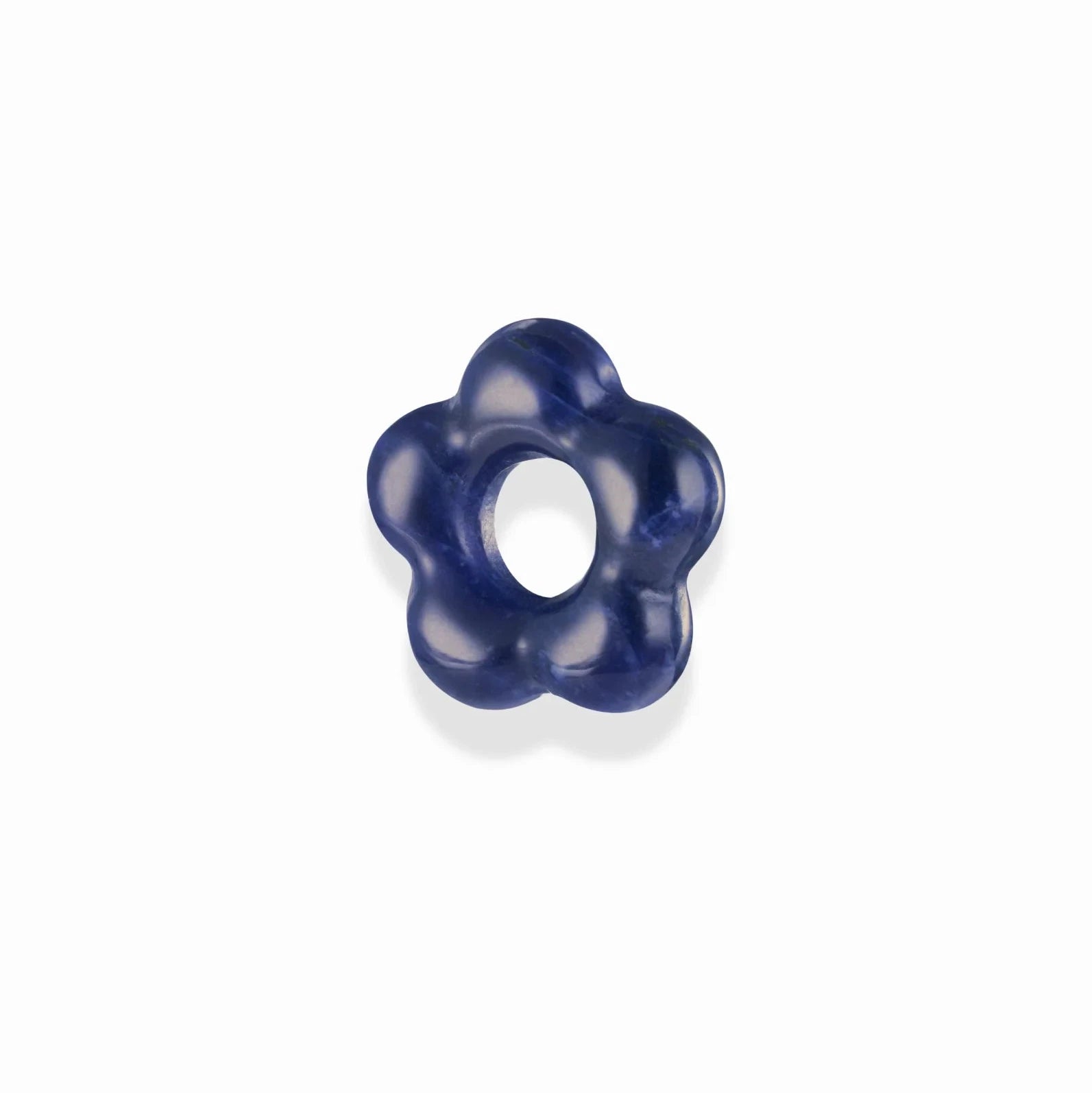 a blue gemstone spacer bead in the shape of a flower over a white background