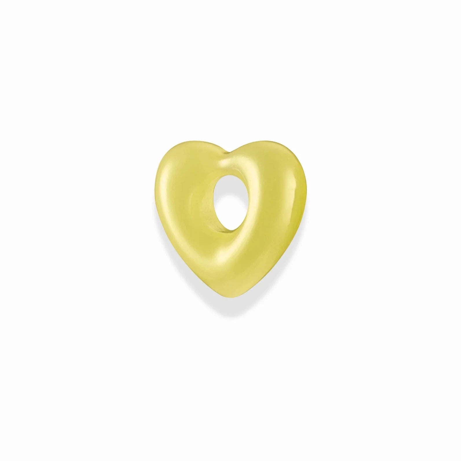 a yellow heart shaped gemstone spacer charm over a white background