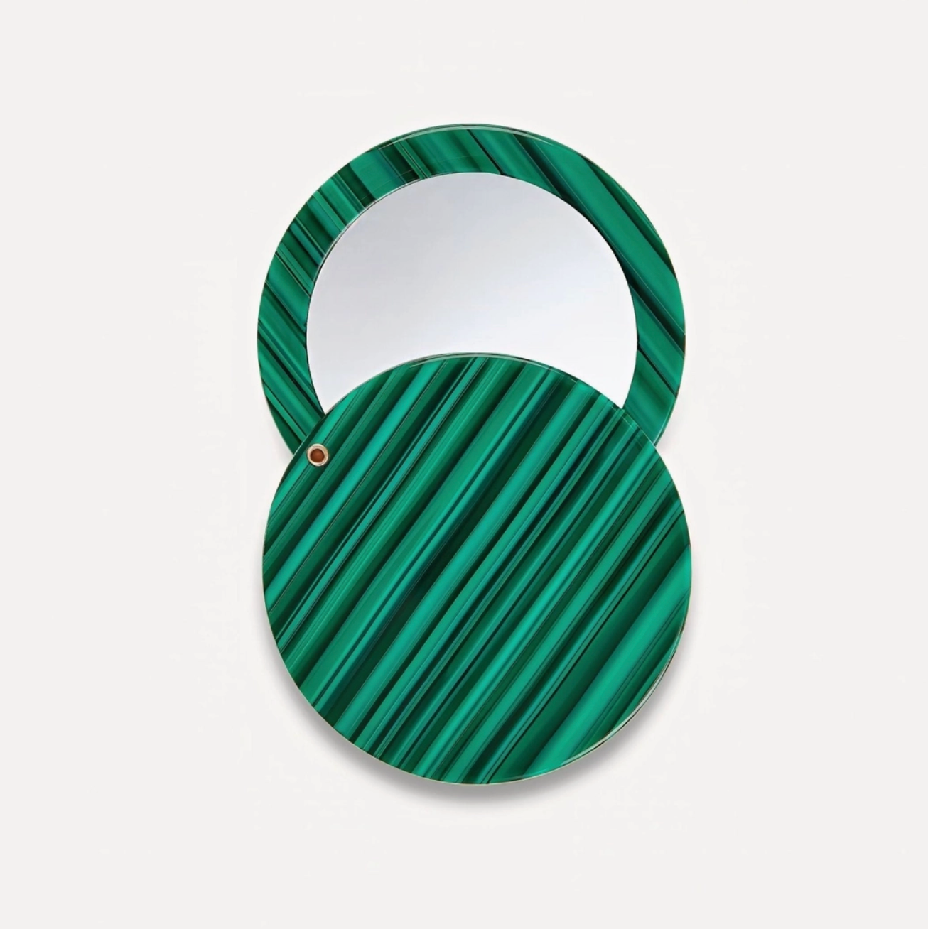 Green malachite patterned round mirror on a light gray background