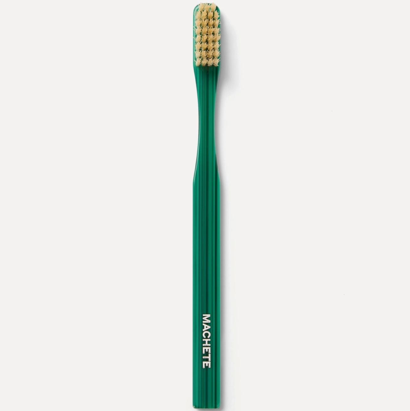 Green  malachite pattern toothbrush with bristles on a white background