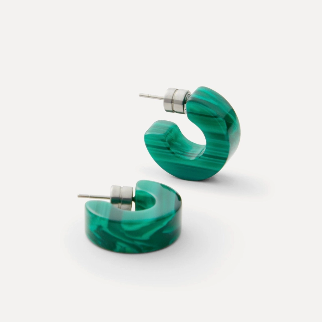Green marbled hoop earrings on a white background