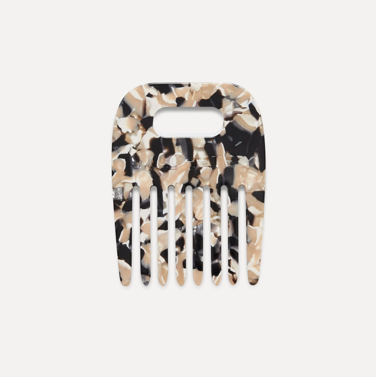 tortoise shell pattern comb on a white background