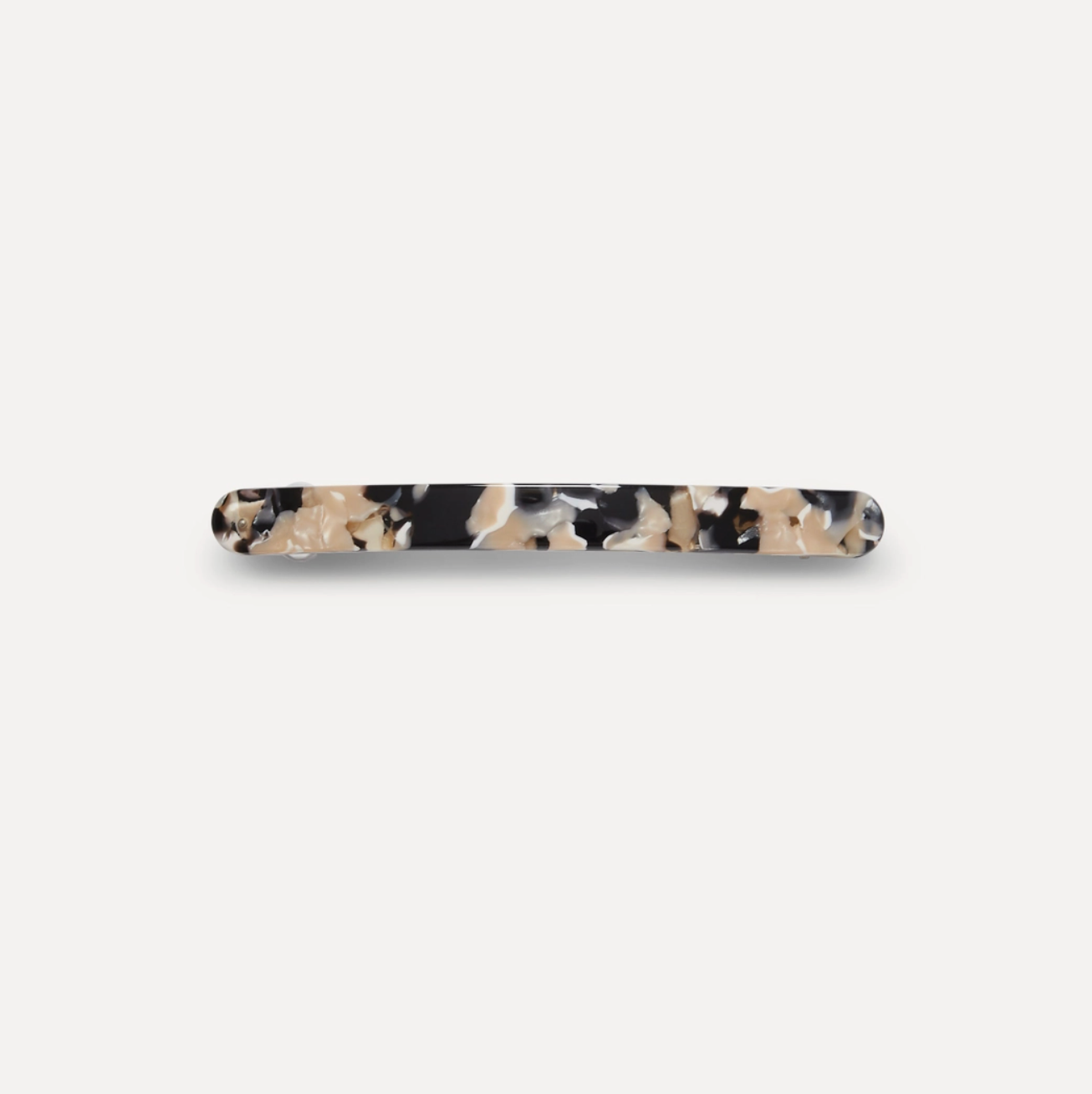 tortoise patterned hair clip on a white background